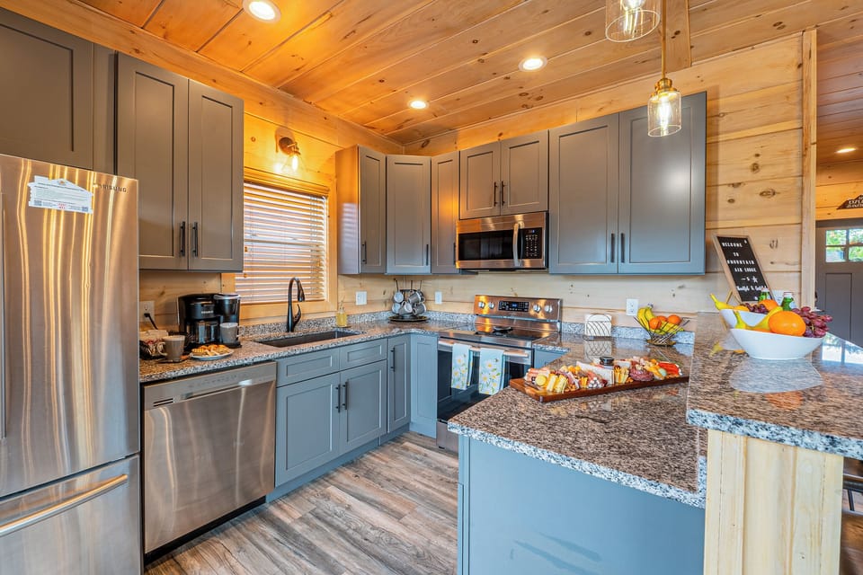 Open, fully equipped kitchen with bar seating for 3 and everything you need.