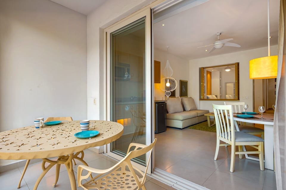 Enjoy meals outdoors on the furnished terrace, offering a comfortable setting for morning coffee or evening dining.