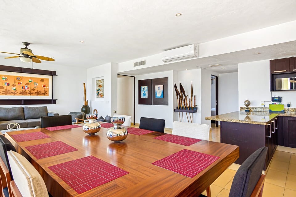 Gather around the spacious dining table, perfect for shared meals and memorable moments with family and friends. Fully equipped kitchen with modern finishes and ample counter space.