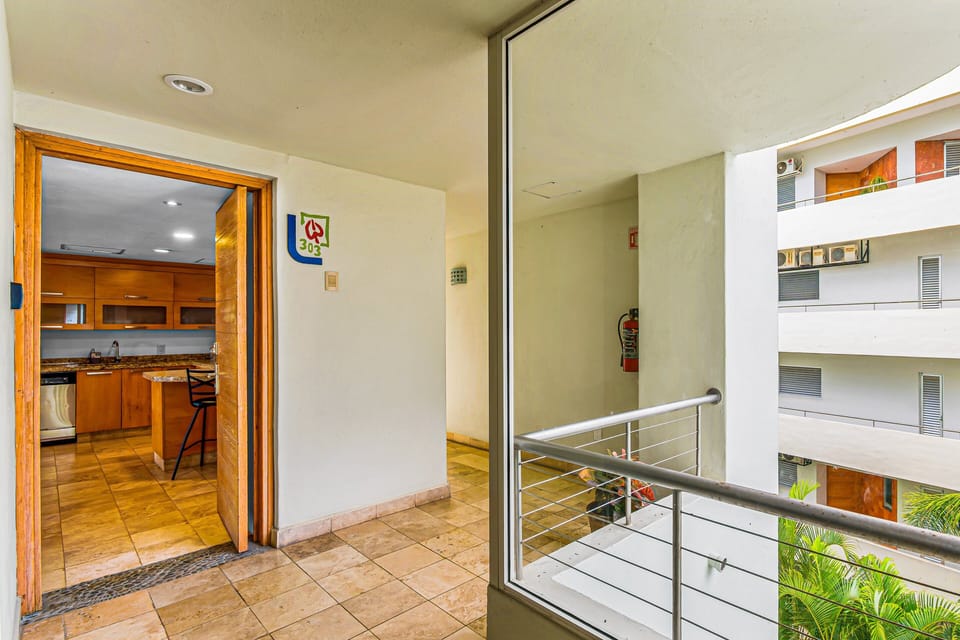 Bright indoor-outdoor space with direct balcony access and open views. Designed for comfort and relaxation, offering a seamless blend of indoor living and fresh tropical air.