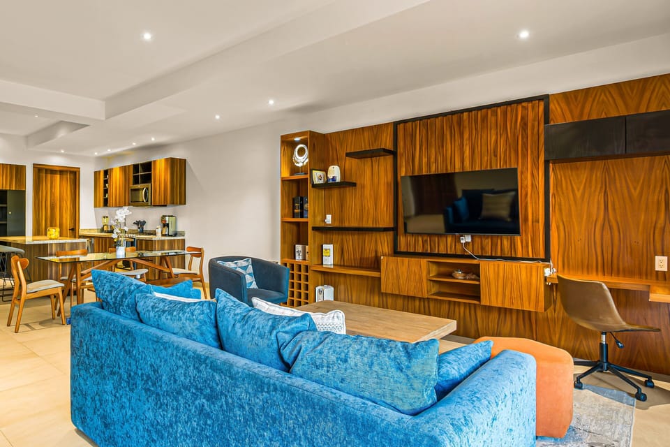 The living, dining, and kitchen areas flow seamlessly together, creating the perfect space for gathering with family and friends.