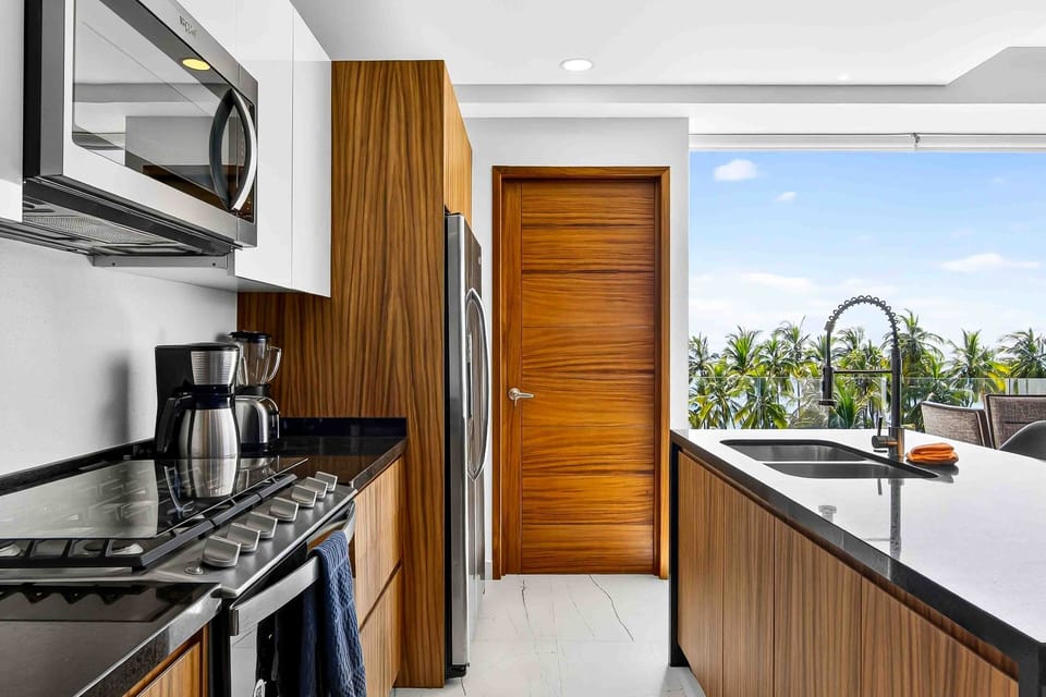 This modern kitchen offers premium finishes, ample prep space, and everything needed for cooking and entertaining.