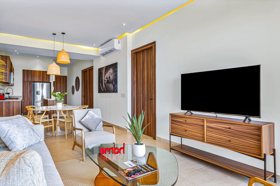 Unwind with your favorite shows on the large Smart TV in this thoughtfully designed living space, offering comfort, style, and plenty of room to relax.