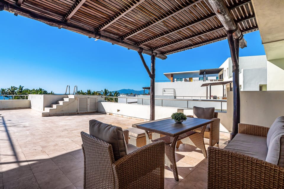 Enjoy open-air dining on the spacious rooftop terrace with ocean breezes, shaded seating, and beautiful tropical views.