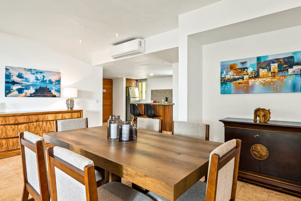 Enjoy meals, conversations, and unforgettable vacation moments in a spacious open dining area connected to the stylish living room.