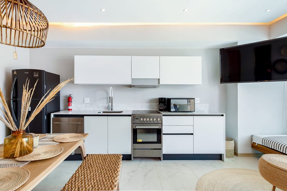 Modern kitchen featuring quality appliances, generous counter space, and all the essentials needed for cooking, dining, and enjoying a comfortable stay.