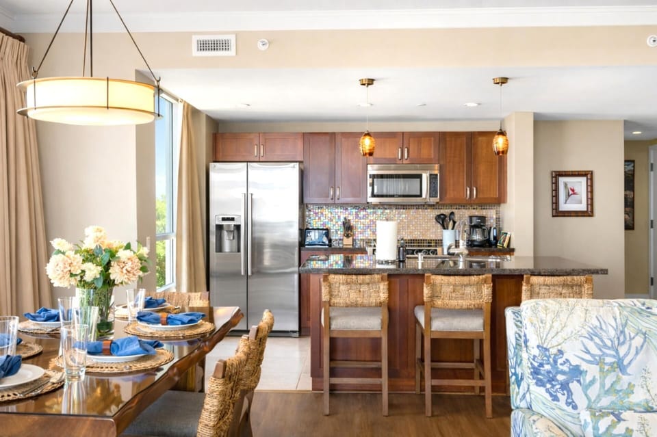 Your open dining area sits beside the kitchen and living room, creating an inviting place to gather for meals, conversation, and shared vacation moments. HKH-515