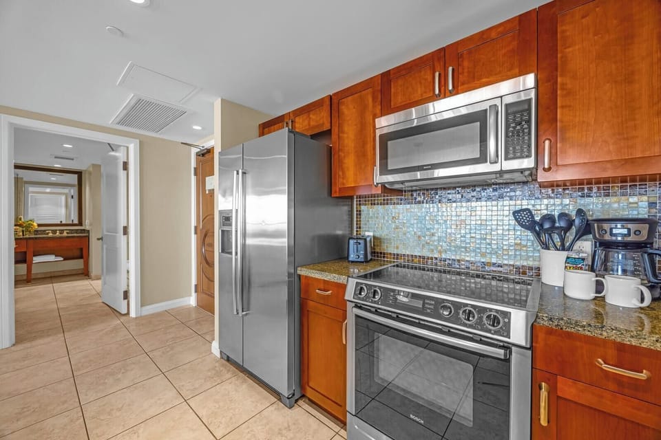 Stainless steel appliances and generous counter space for easy cooking HKK-203