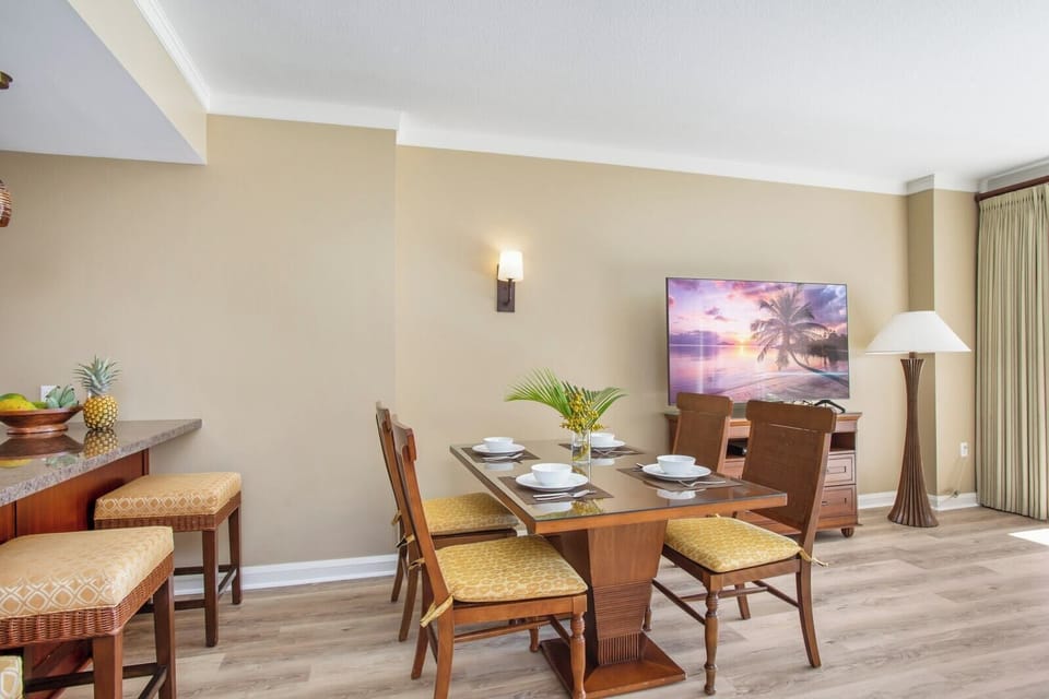 Tropical dining setting with warm tones, island fruit, and ambiance. HKK-229