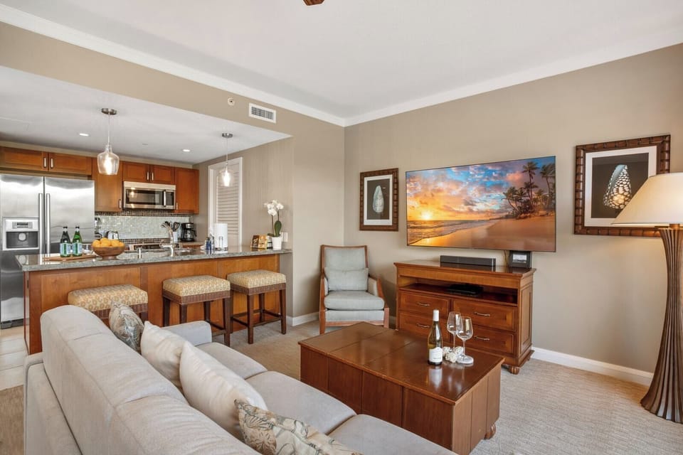 Enjoy open-plan comfort with full kitchen, modern amenities, HDTV & cozy seating—perfect Maui getaway vibes HKK-236