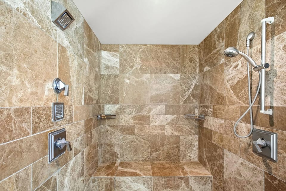 Spacious shower with dual heads make for ultimate luxury  HKK-449
