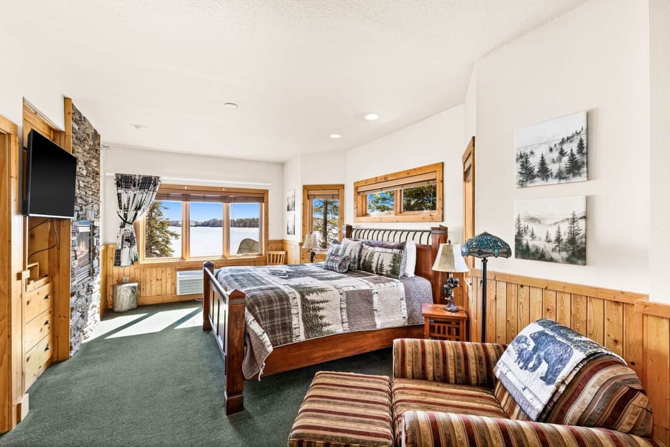 Spacious king bedroom with plush comfort and beautiful lake views right from the window.