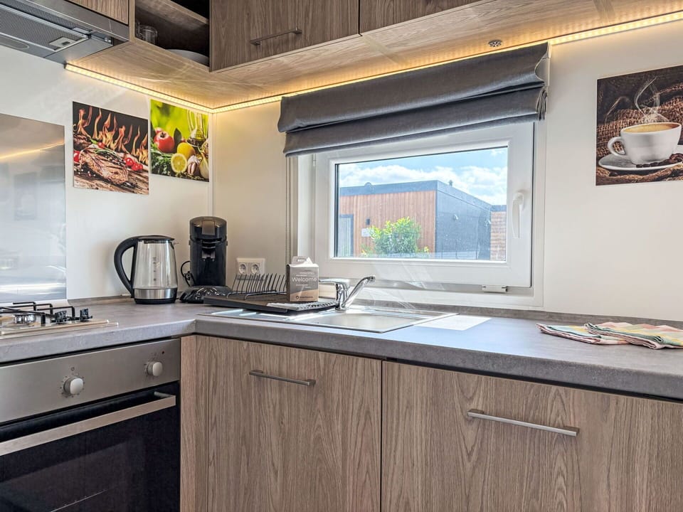 Kitchen, Countertop, Kitchen Appliance, Home Appliance, Major Appliance, Wood Stain, Plumbing Fixture, Cabinetry, Hardwood, Tap