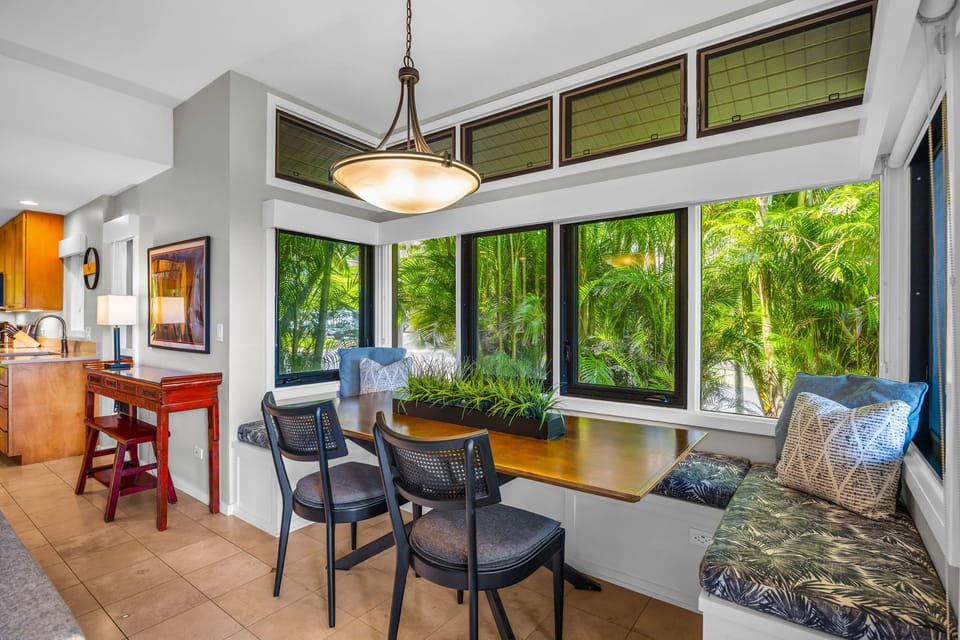 The breakfast nook features comfortable seating and foliage views KRV-311