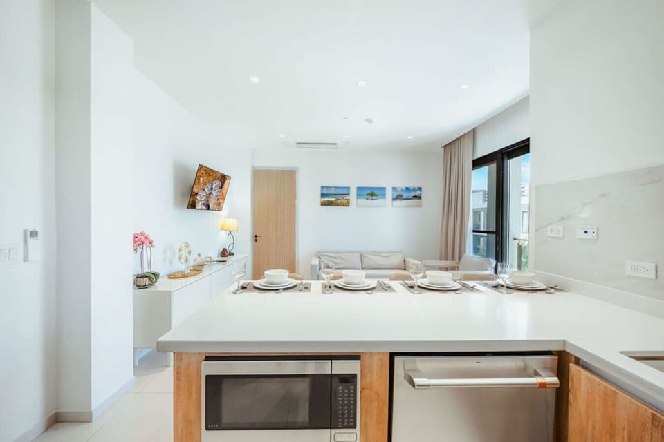 Enjoy cooking and dining in a modern kitchen that flows into the cozy living area.
