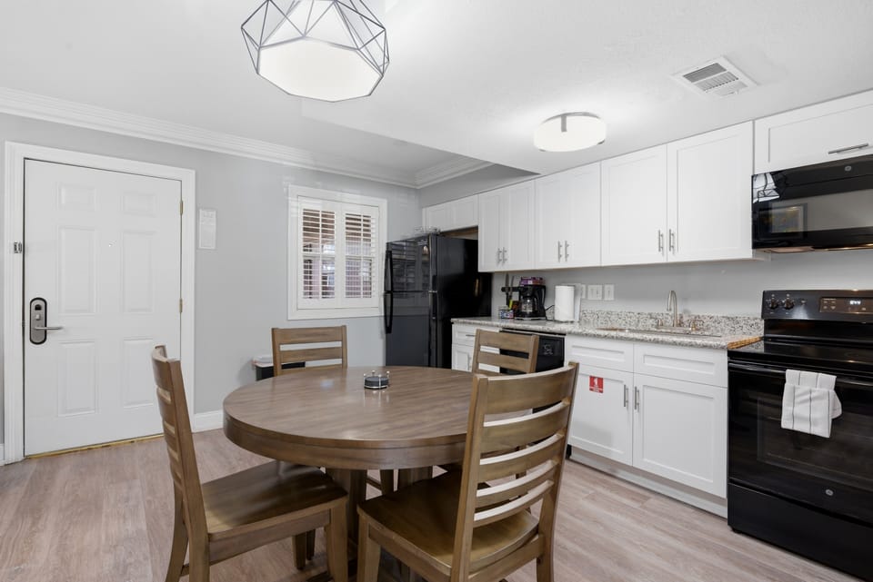 Unit 204 spacious kitchen w/ full appliances & a cozy dining nook.
