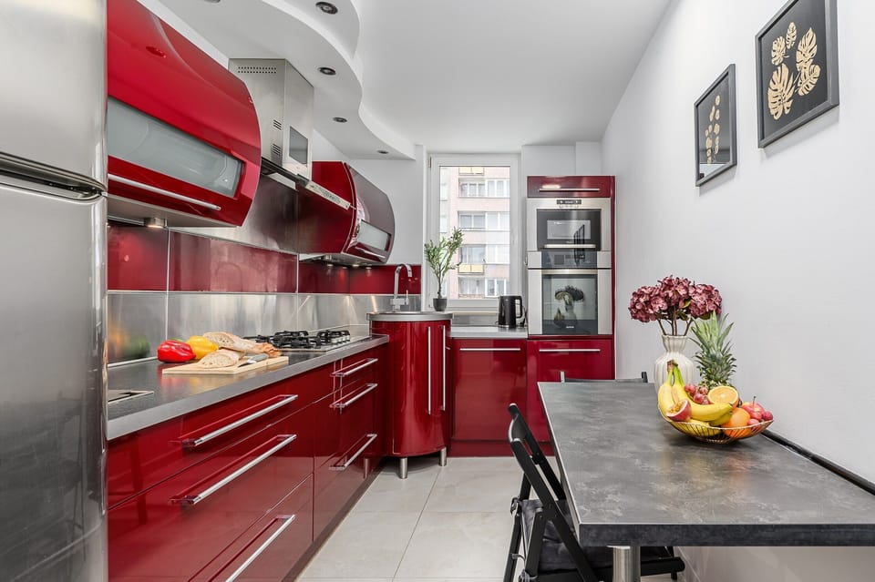 Comfort Apartment, Balcony, City View | Private kitchen | Griddle, spices, cleaning supplies, freezer