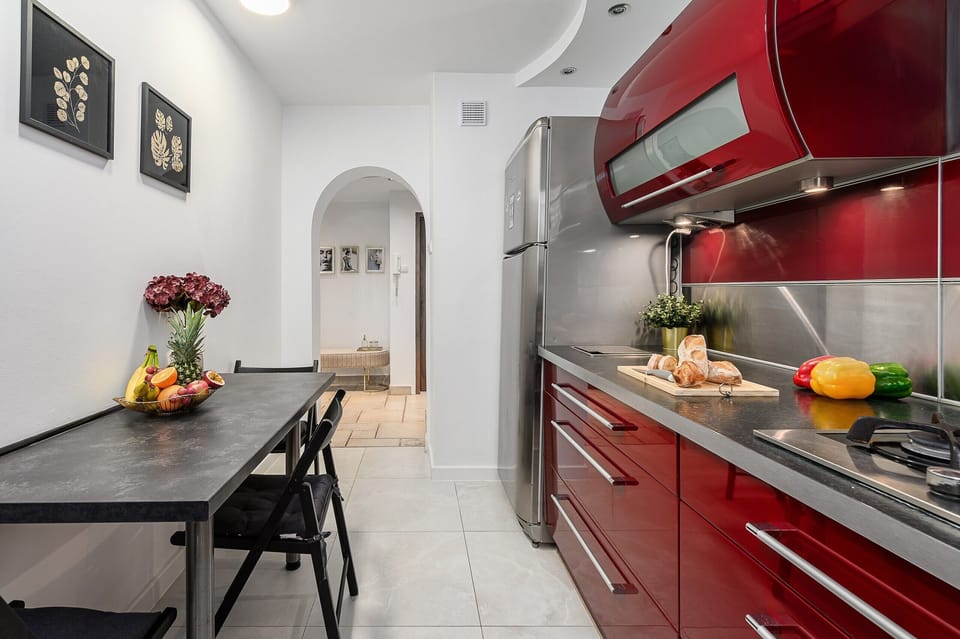 Comfort Apartment, Balcony, City View | Private kitchen | Griddle, spices, cleaning supplies, freezer