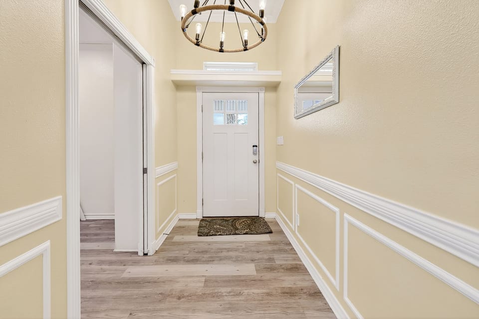 Step through your welcoming entrance into elegant hardwood floors and classic wainscoting that sets the tone for your refined getaway.