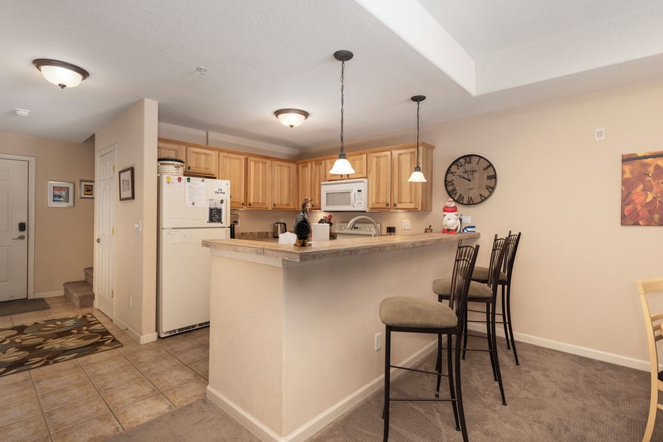 Your spacious kitchen awaits with granite counters, breakfast bar seating, and all the appliances you need to create memorable meals together.