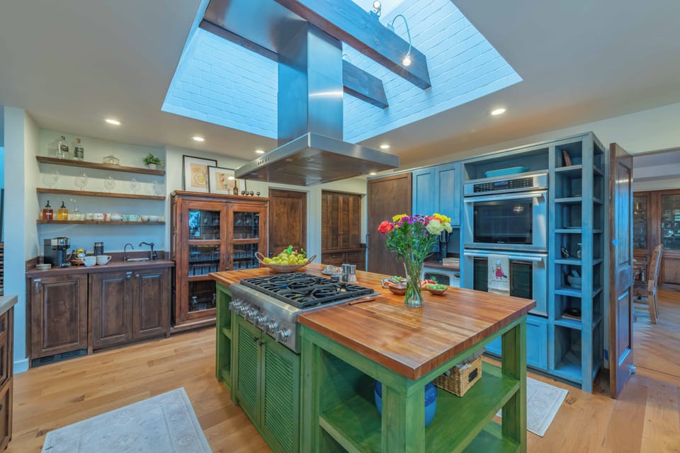 Your chef's dream kitchen awaits with a stunning skylight, spacious island, and premium appliances for memorable meal preparation.