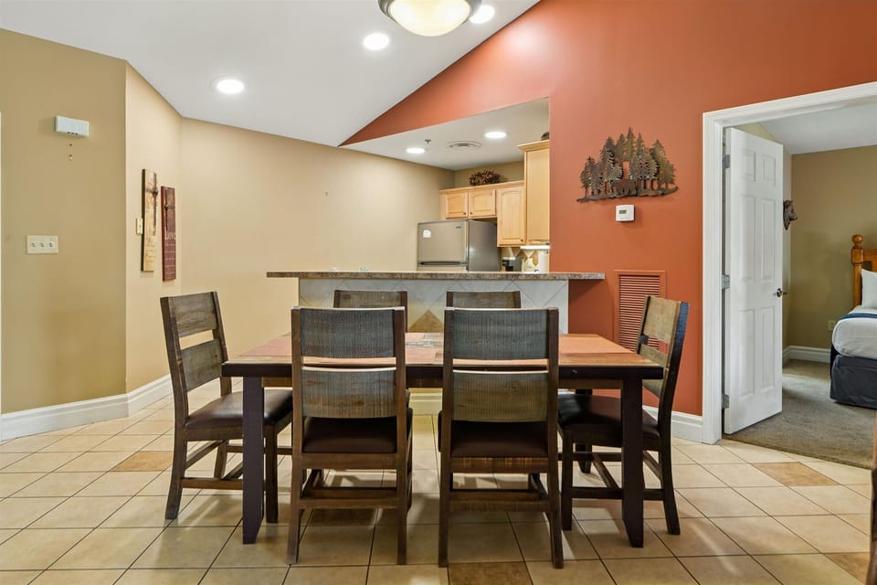 You'll love gathering around this spacious dining table for memorable meals, with warm lighting and a fully equipped kitchen nearby for easy entertaining.