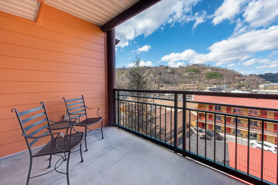Step onto your private balcony and soak in sweeping mountain views while enjoying morning coffee in comfortable outdoor seating.