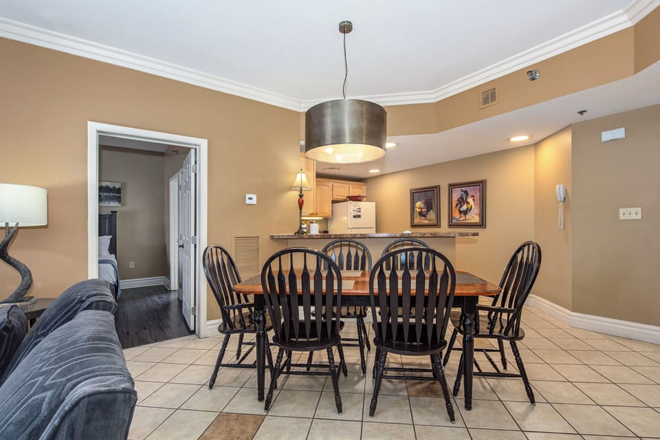 Gather around your spacious dining table for memorable meals with loved ones in this warm, inviting space.