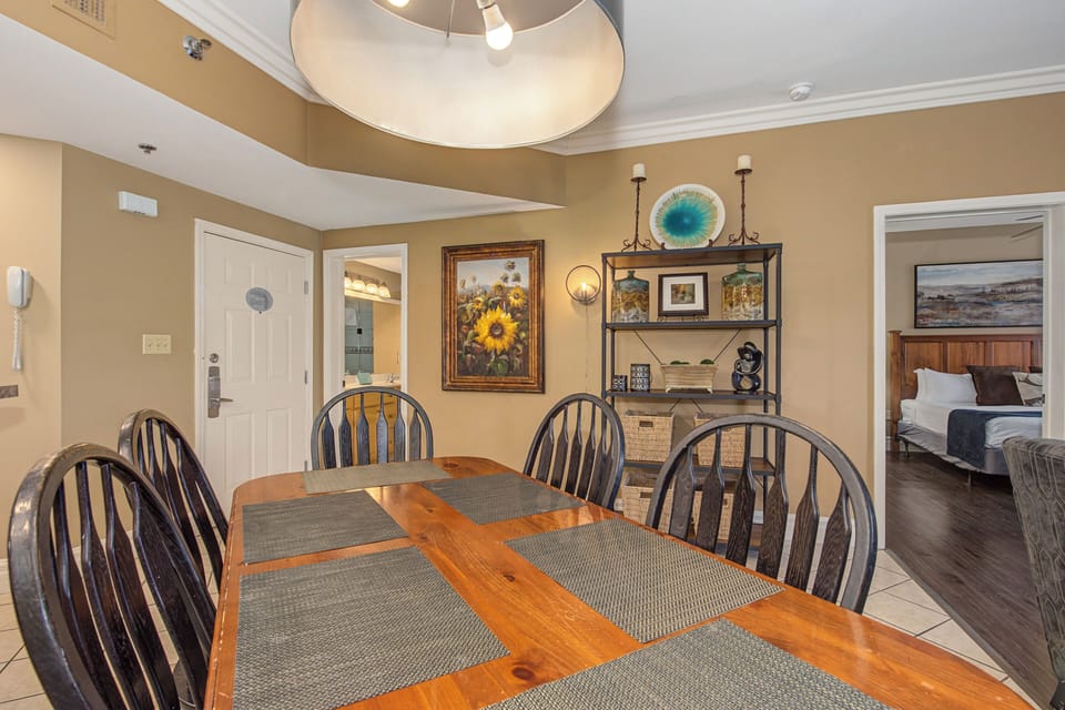 Gather around this spacious dining table where your group can share meals and create memories in this beautifully appointed space.