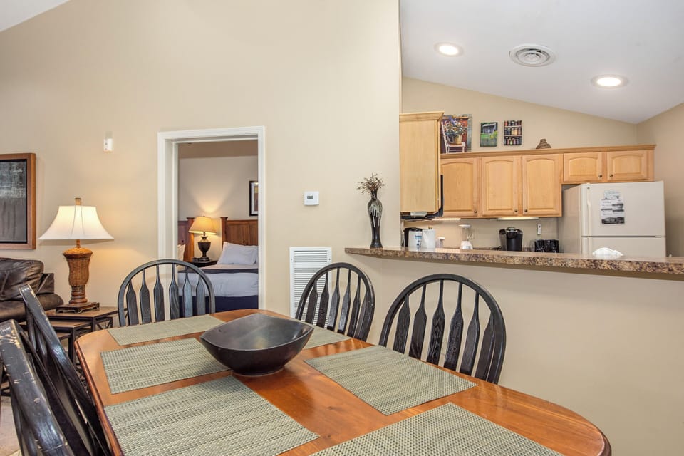 Your open dining area flows seamlessly into the fully equipped kitchen, perfect for memorable meals together.