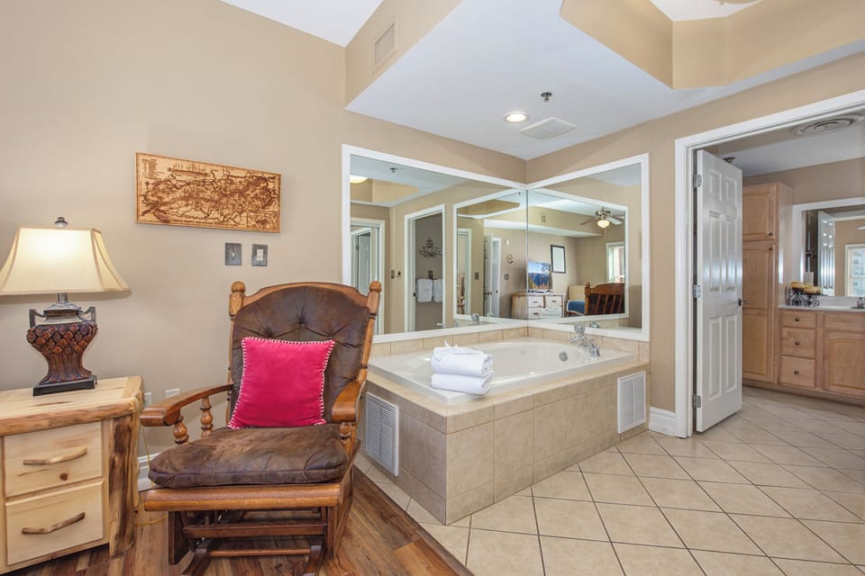 Sink into your private jetted tub surrounded by warm rustic charm and soft lighting for the ultimate relaxation retreat.