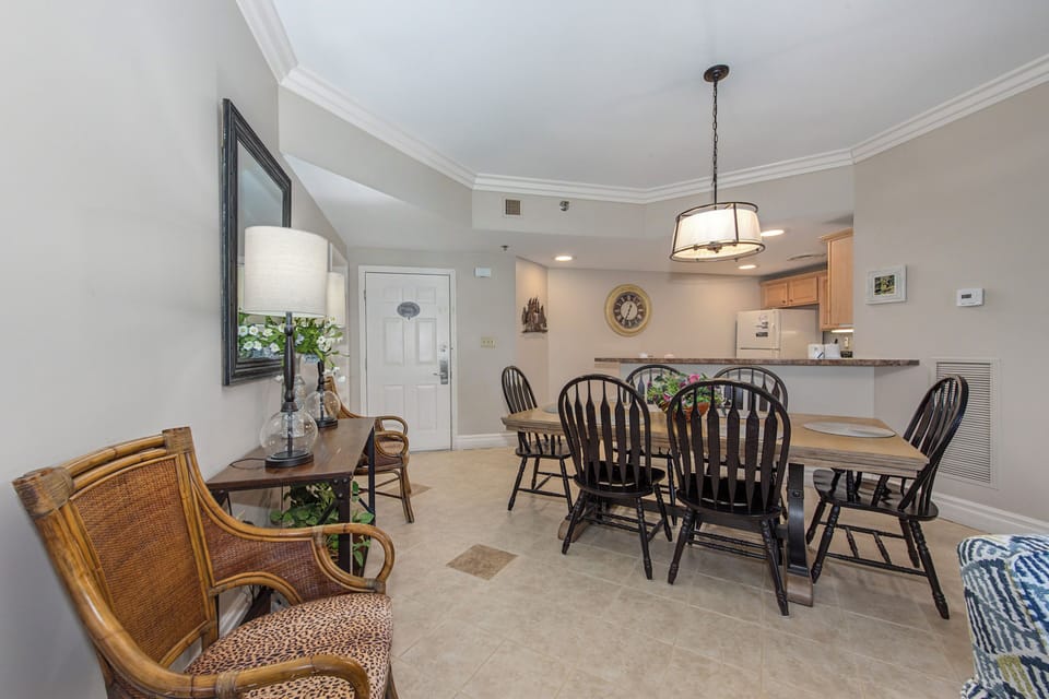 Gather around your elegant dining table with Windsor chairs, perfect for memorable meals together in this graciously appointed space.