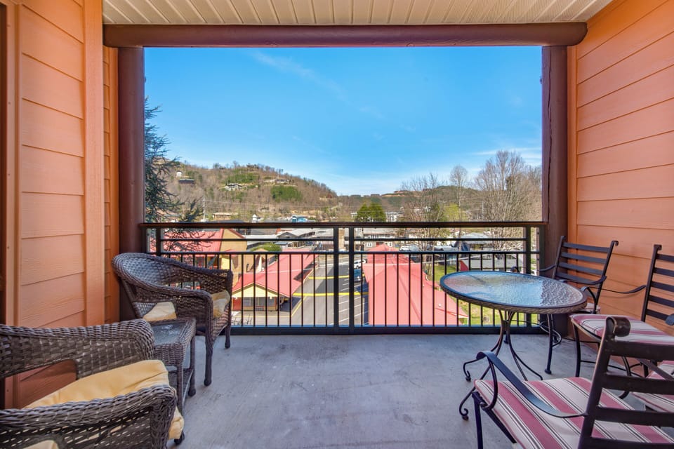Unwind on your private balcony with mountain views, perfect for morning coffee or evening relaxation with comfortable seating.