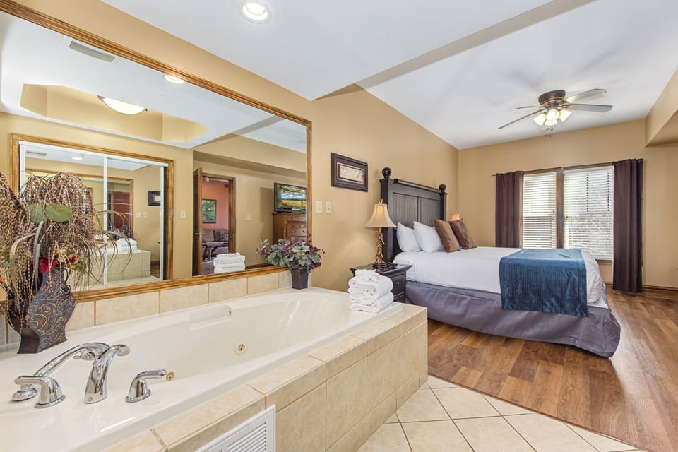 Unwind in your romantic suite featuring a jetted tub perfect for soaking after exploring, plus plush bedding and warm lighting.