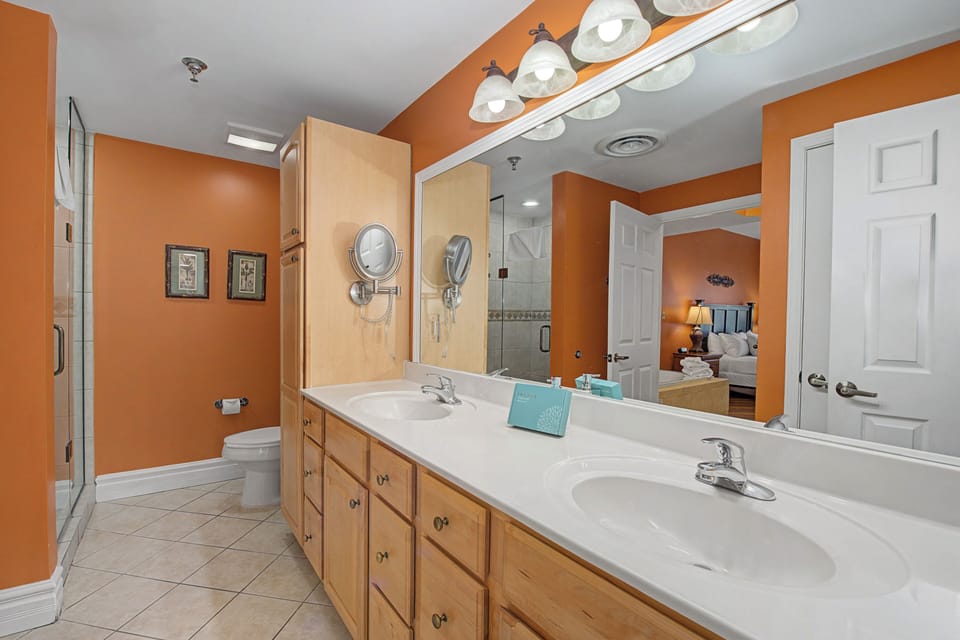 Your spacious master bathroom features dual sinks, warm lighting, and a glass shower for a luxurious start to each day.