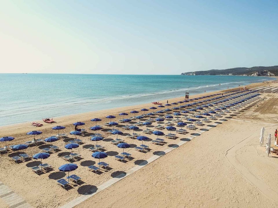 Private beach, white sand, sun loungers, beach umbrellas
