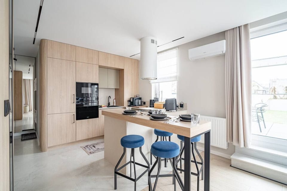 Modern Kitchen with Island, Coffee Machine and Dining Space | Book Now with RENTUJEMY.COM