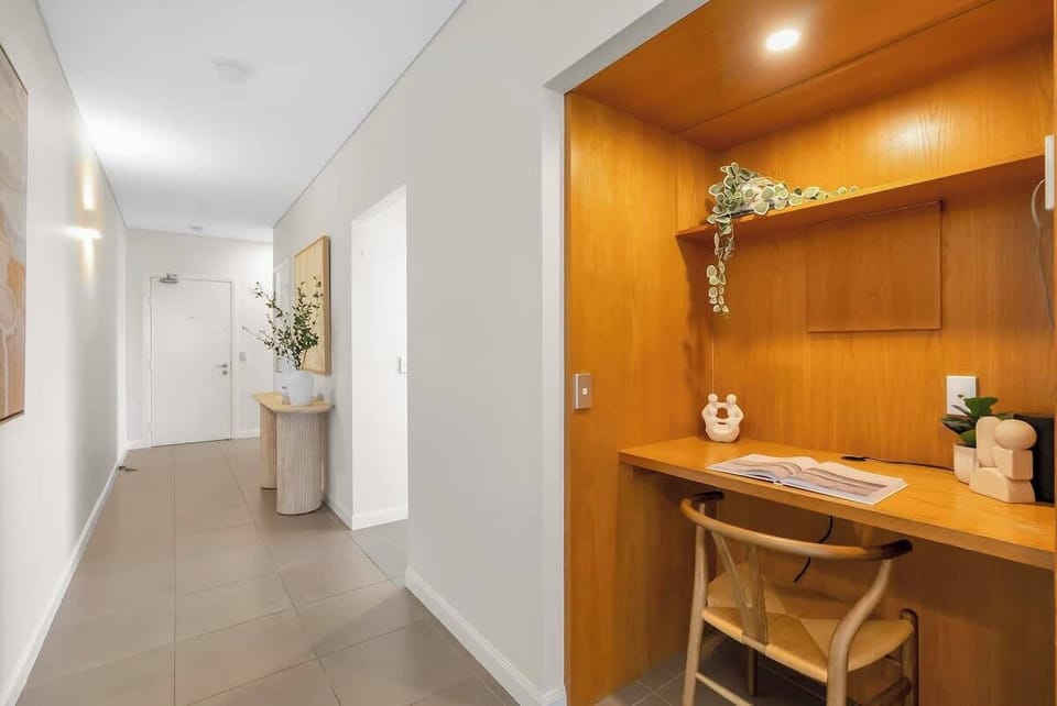 Along the hallway, you'll find a built-in study space, ideal for staying connected or working remotely with ease.