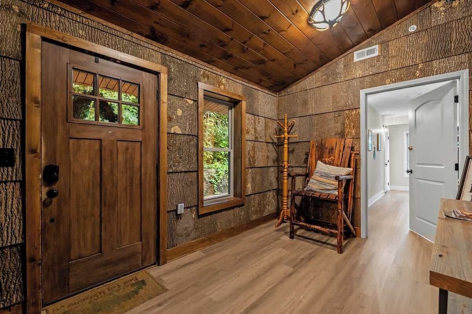Rustic cabin-style entryway with warm wood details and cozy charm