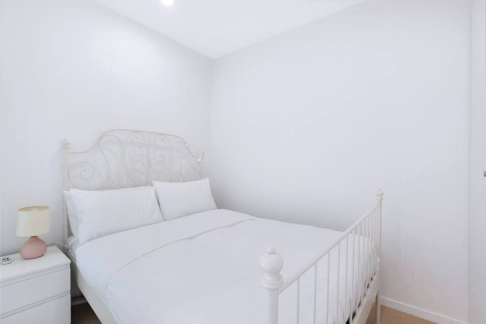 Wake to city views in the second bedroom, where a double bed offers a calm and cosy retreat.
