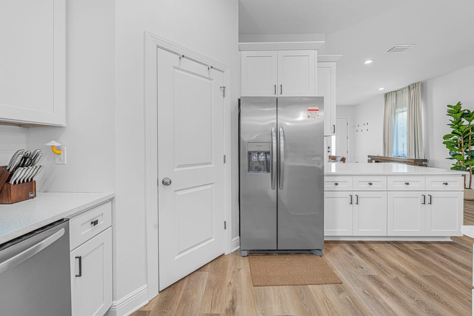 Clean and modern kitchen with stainless steel appliances, ample cabinetry, and a functional layout.