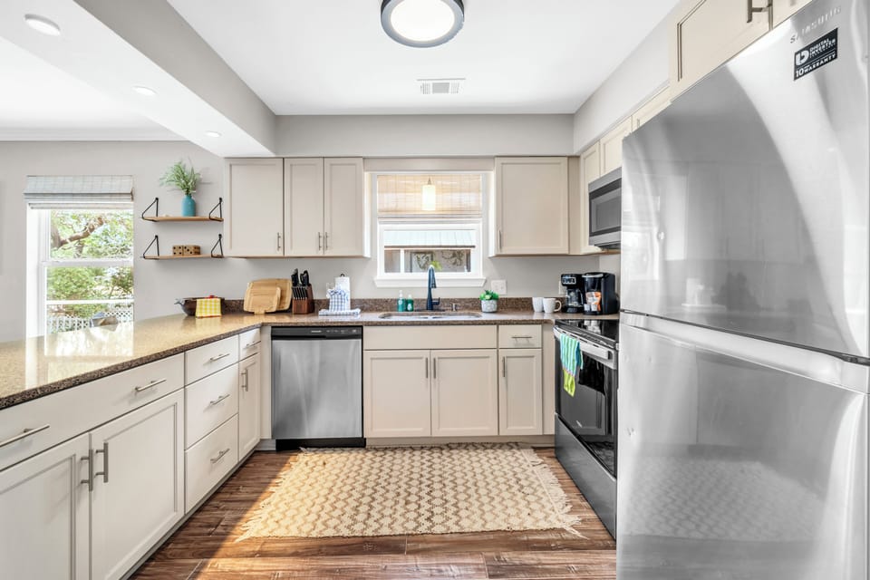 Step into your fully-equipped kitchen featuring stainless steel appliances, granite countertops, and everything you need to create memorable meals during your stay.