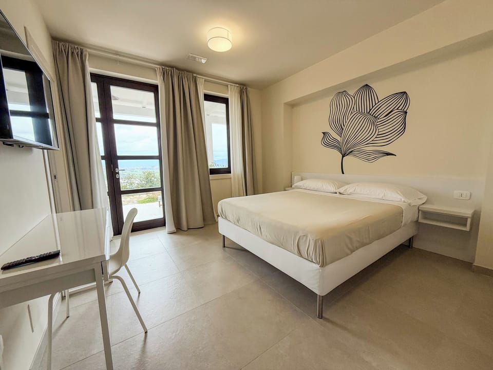 Deluxe Quadruple Room, Patio, Garden View | In-room safe, blackout drapes, free WiFi