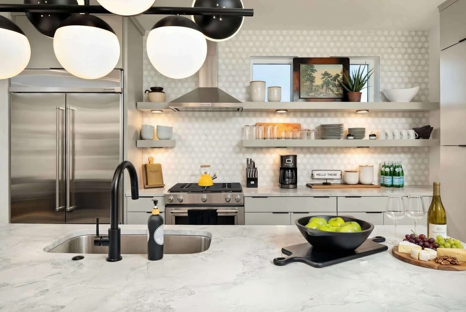 Experience culinary bliss in this chic kitchen, perfect for whipping up meals while enjoying the vibrant Nashville vibe. Embrace luxury and style in your Nashville Vacation Homes with Misfit Homes. Reserve your stay today!