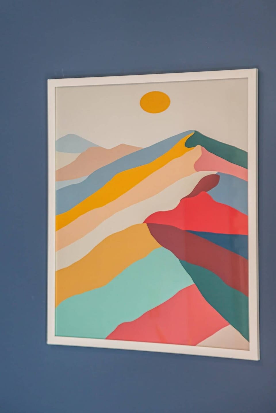 Contemporary wall art accent bringing color and vibrance into the room.