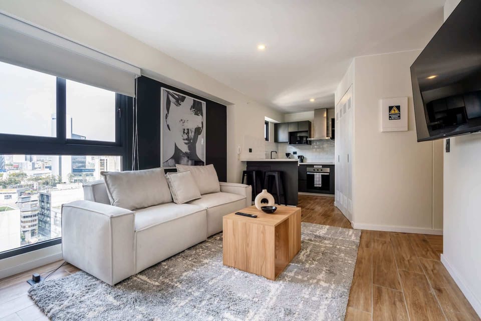 Bright living room and kitchen layout showcasing the seamless flow of the space.
