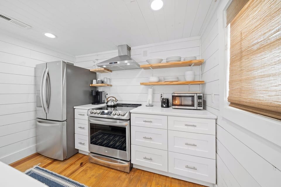 Well stocked kitchen with stainless steel appliances (Fridge, freezer, range oven, dishwasher, and microwave)