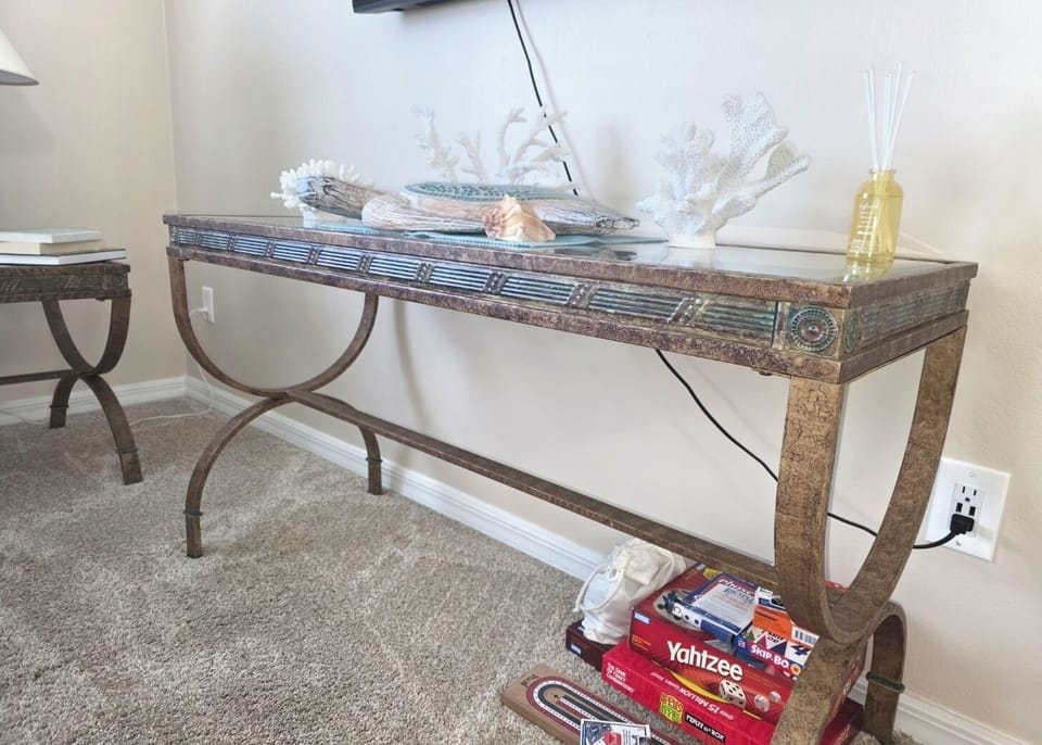 The living room, a small amount of board games & books shown.