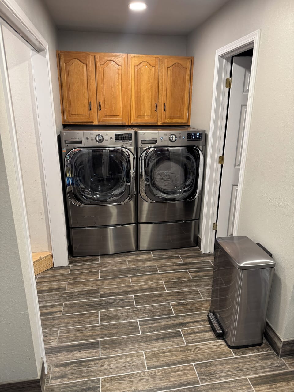 Extra large capacity modern washer/dryer with storage, convenient laundry room