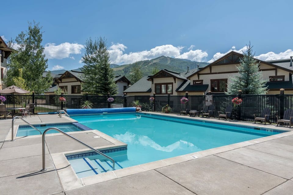 Common area heated pool & hot tub with ski area views  are across from the home (seasonal closures)